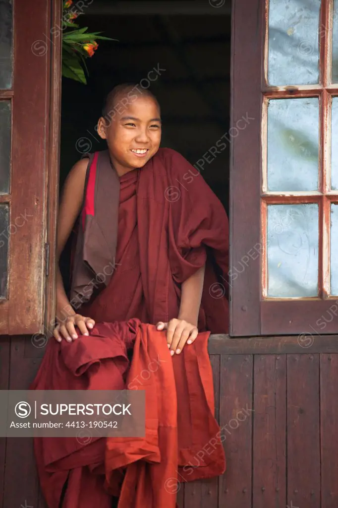 Novice monk looking out the window in Nyaung Shwe Burma