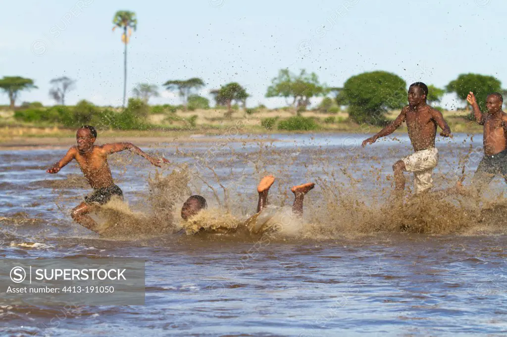 Guys having fun in the flowing Mwagusi at Lulenga Juu Ruaha