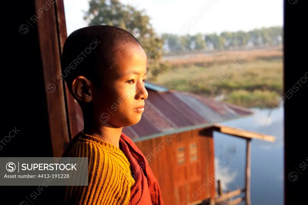 Young monk at sunrise Monastery Nyaungshwe
