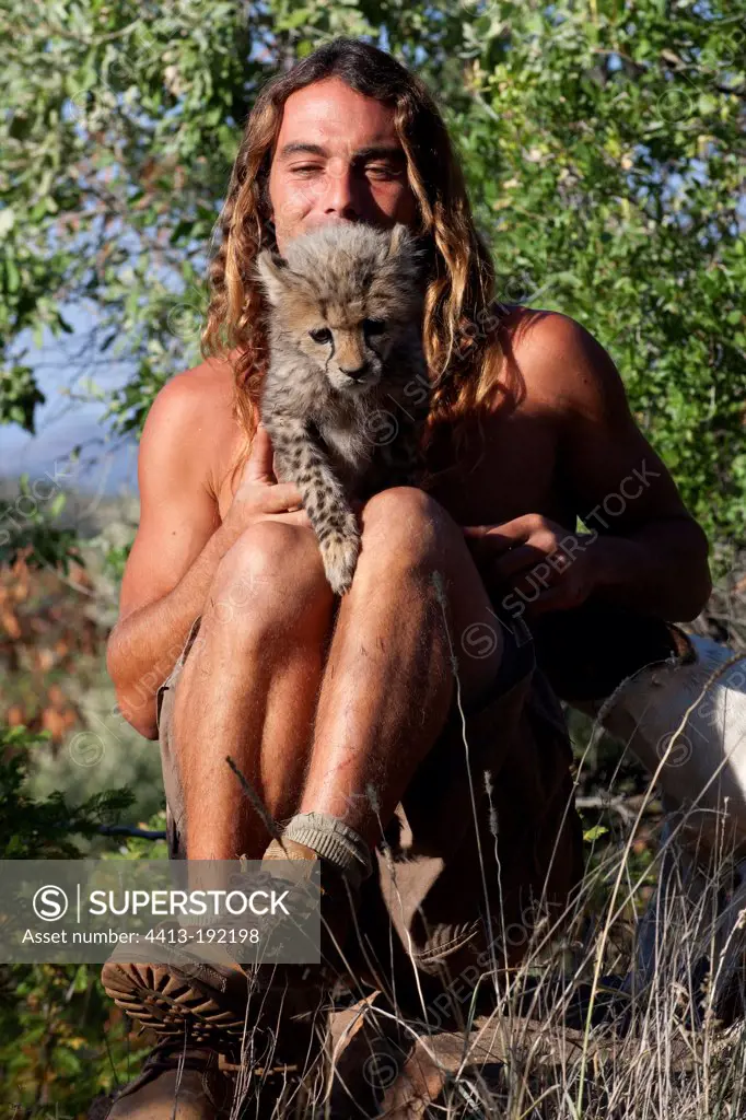 Olivier Houalet taking a Cheetah of one month old Namibia