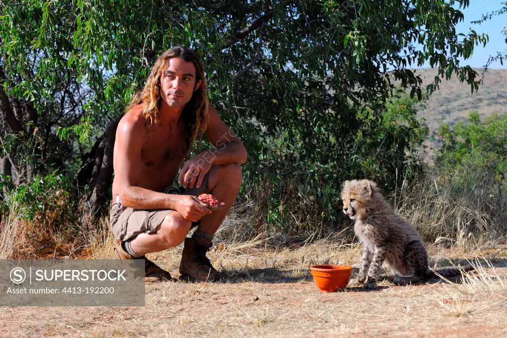 Olivier Houalet with a Cheetah of one month old Namibia