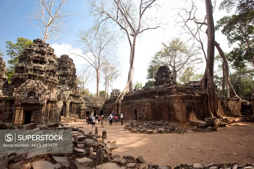 Tourists visiting the temple of Ta Prohm at Angkor Cambodia