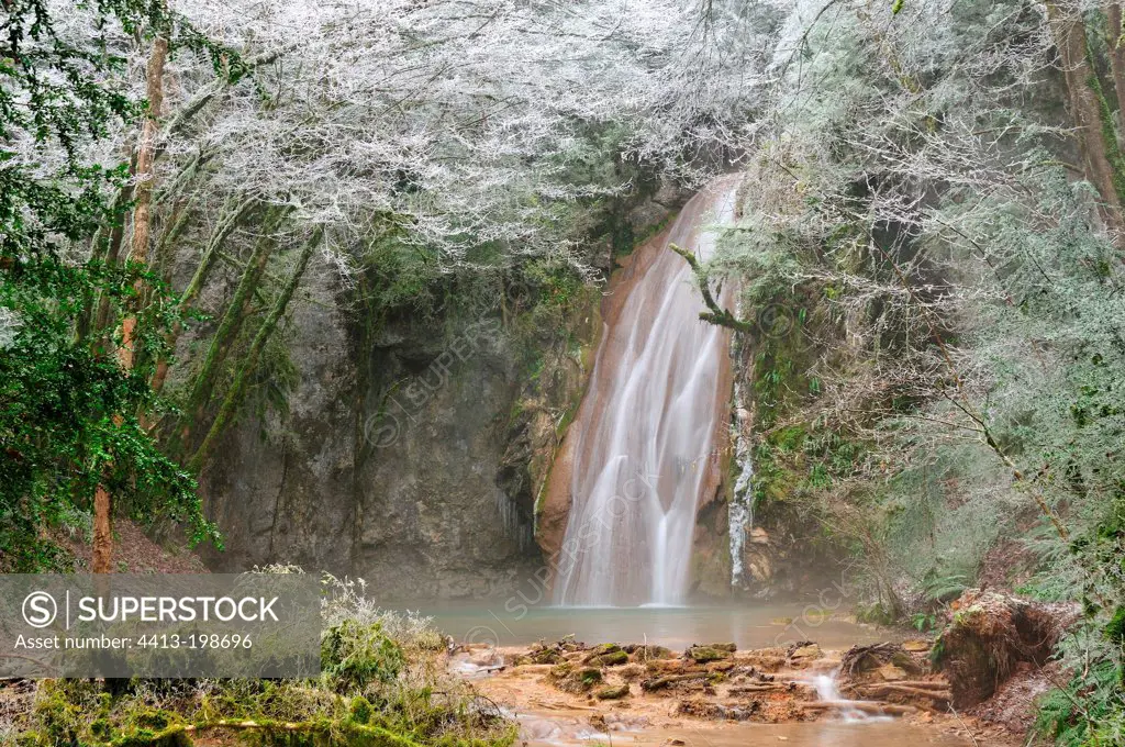 Frost around a waterfall tufa Creek Verbois France