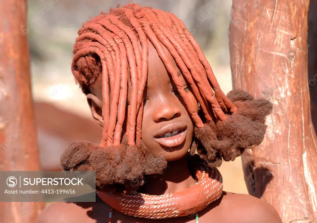 Portrait of a young woman Himba in Namibia