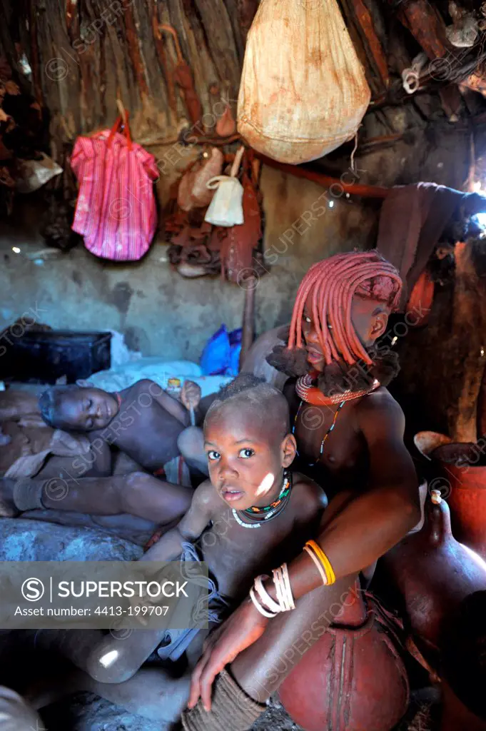Young children in a hut Himba in Namibia
