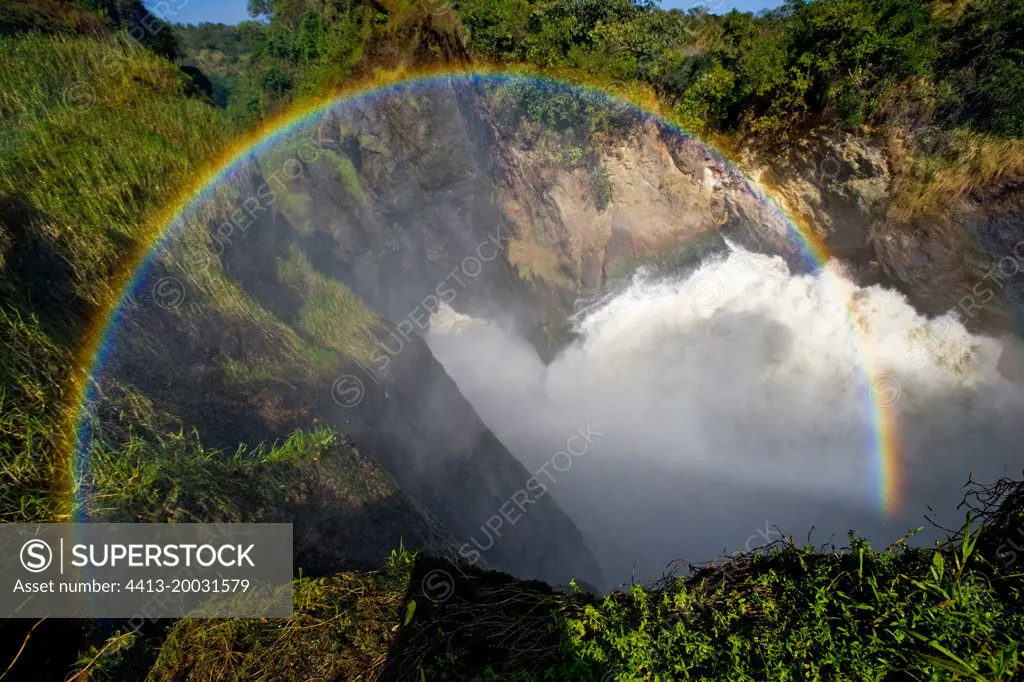 Murchison Falls. Top view of the water stream with a beautiful rainbow. Uganda. East Africa.