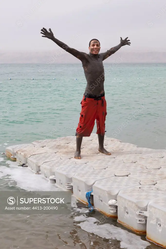 Jordan taking a mud bath in the Dead Sea Jordan