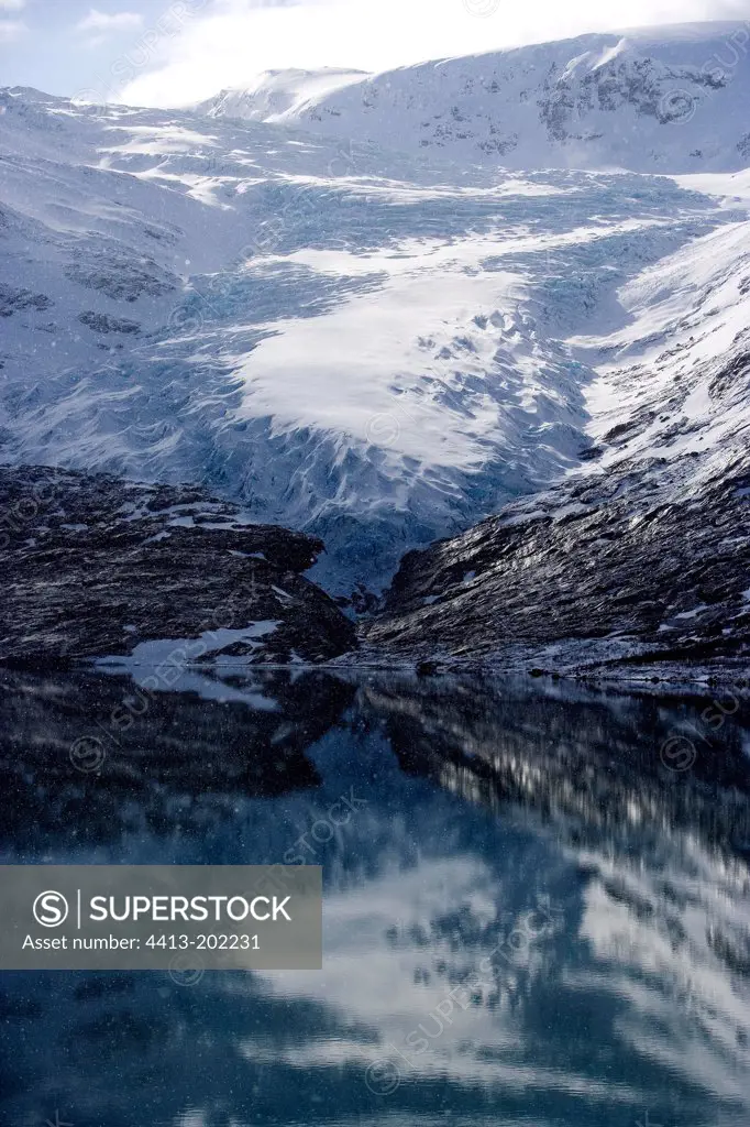 Svartisen Glacier reflecteding in a lake Norway
