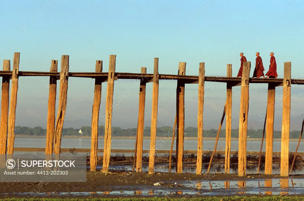 Budhist Birman monks on U Bein teck bridge Burma