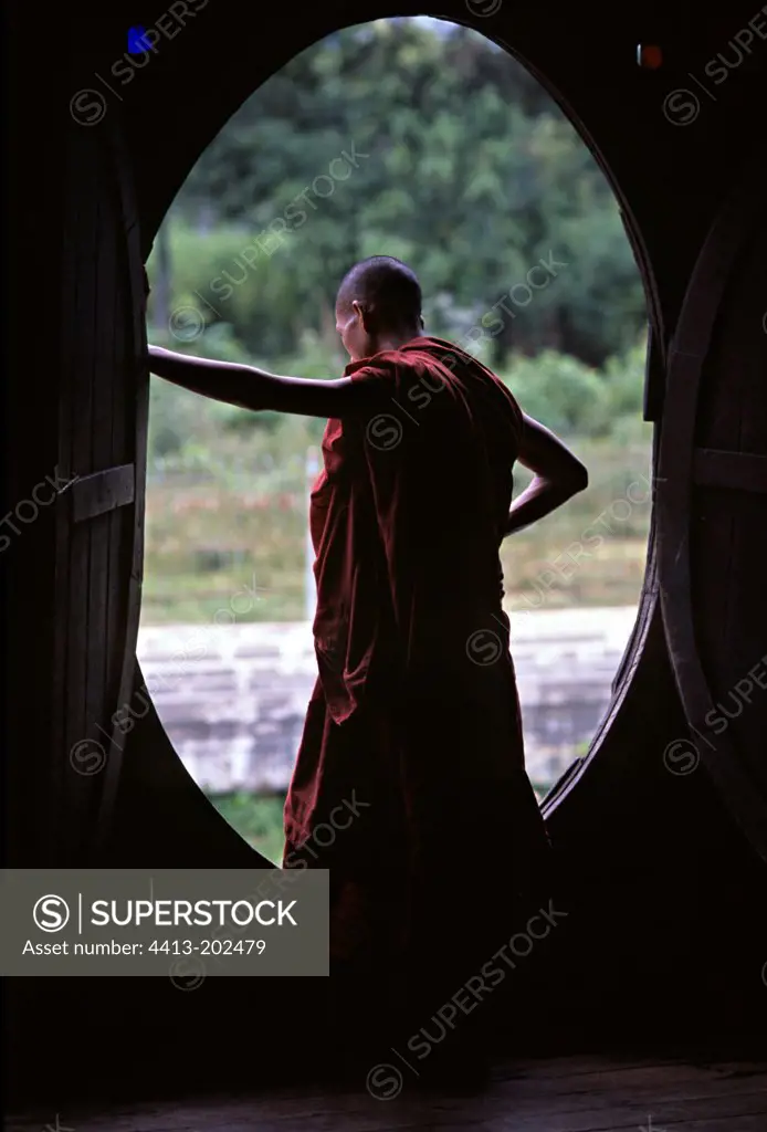 Bhikkhu in a monastery looking outside Burma