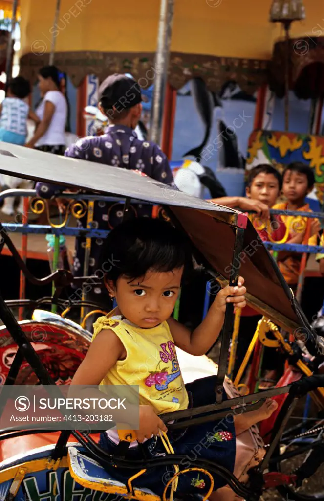 Girl sat in a rickshaw Thailand