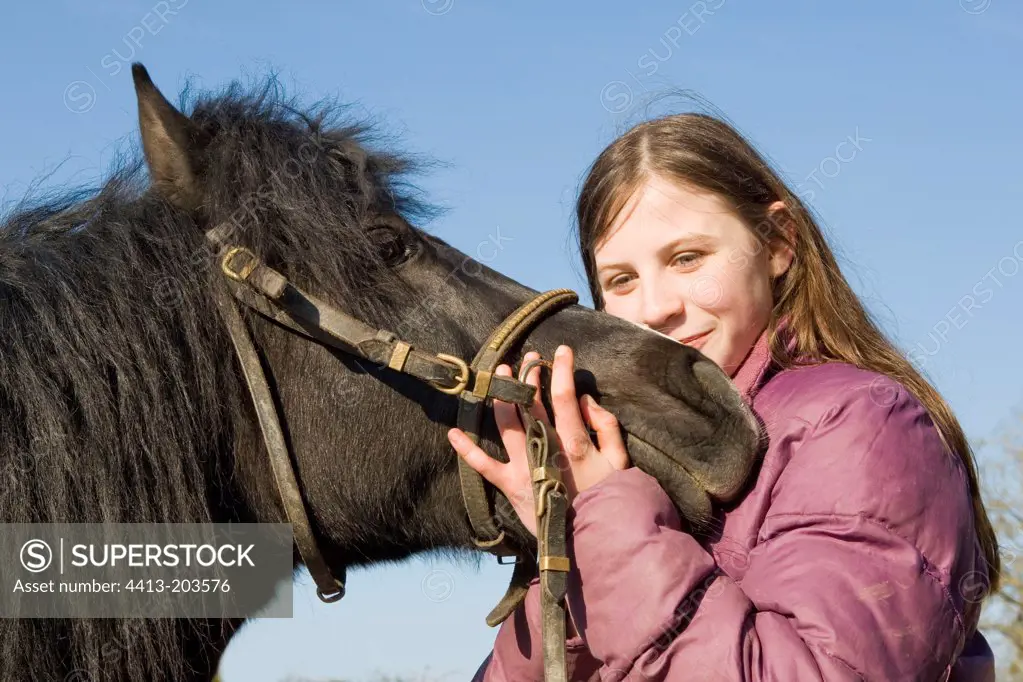 Teenager with her pony France