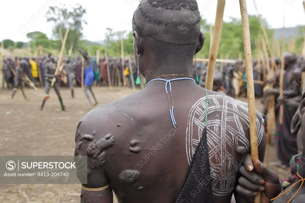Scars and pantings on the back of a Surma warrior Ethiopia