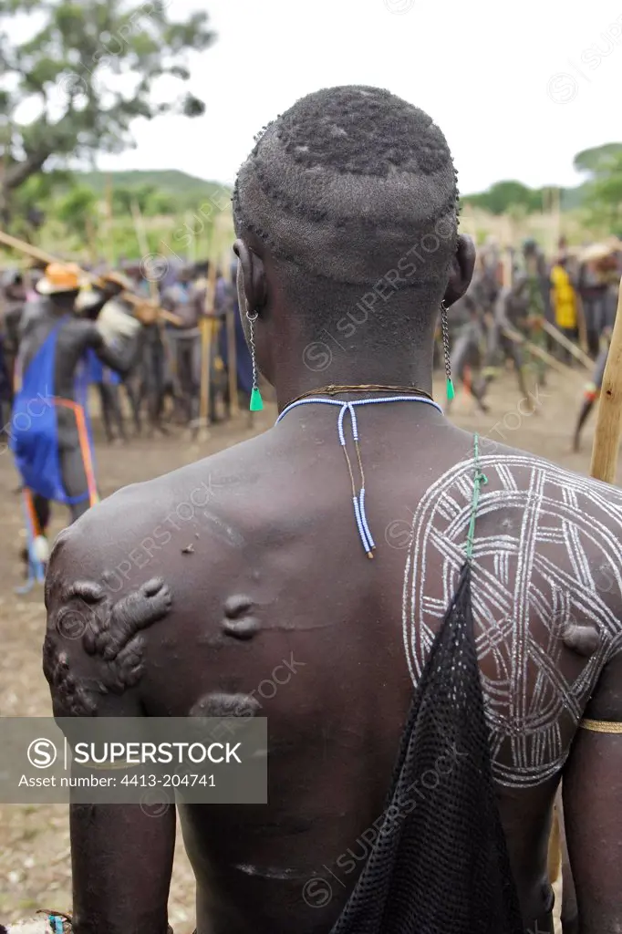 Scars and pantings on the back of a Surma warrior Ethiopia