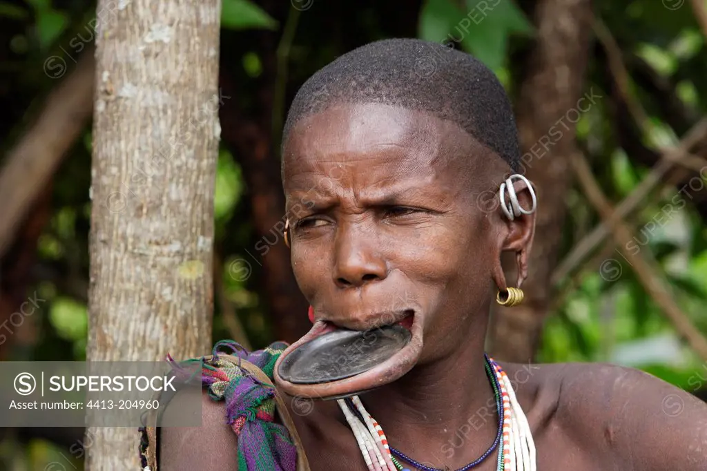 Surma woman wearing a plate in her lower lip Ethiopia
