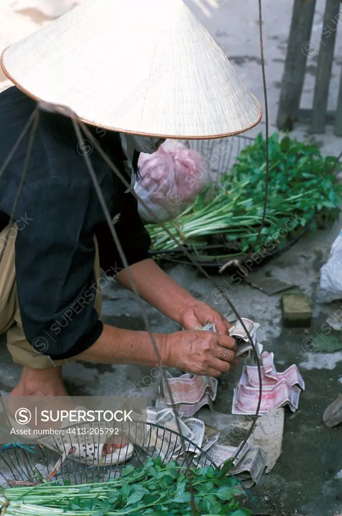 Woman selling vegetables Vietnam