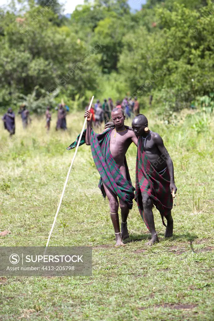 Surma warrior hold up after the ritual stick fighting