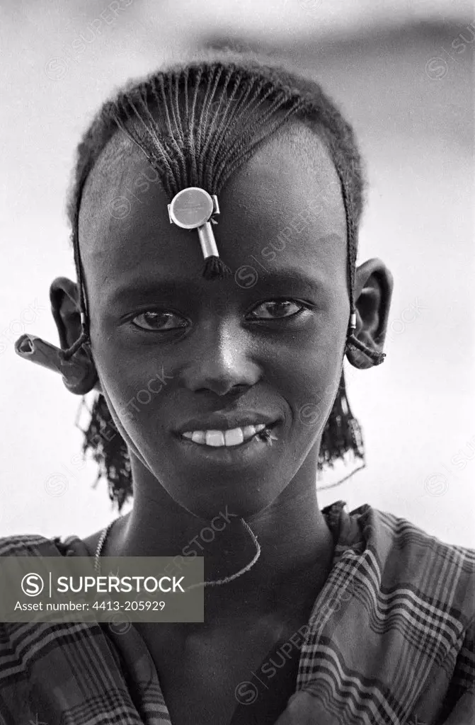 Young Masai warrior bearing the traditional hairdos
