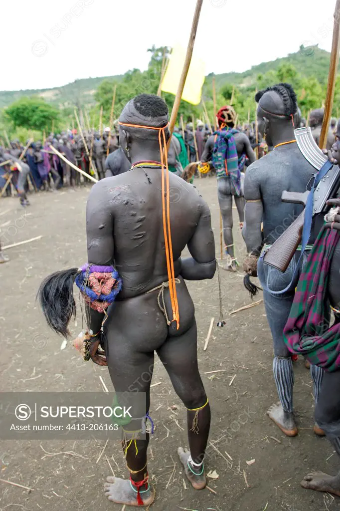 Surma warriors watching a ritual stick fighting Ethiopia