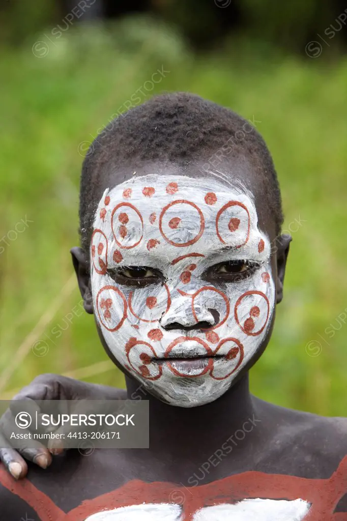 Surma boy with face ritual paintings Ethiopia