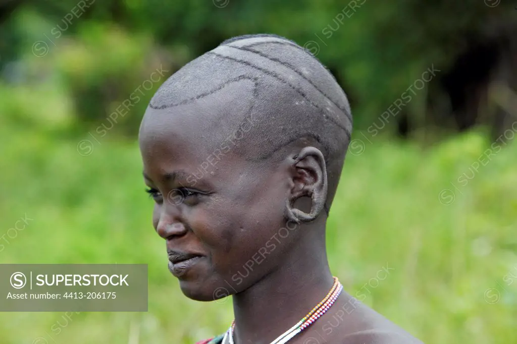 Portrait of a smiling Surma child Ethiopia