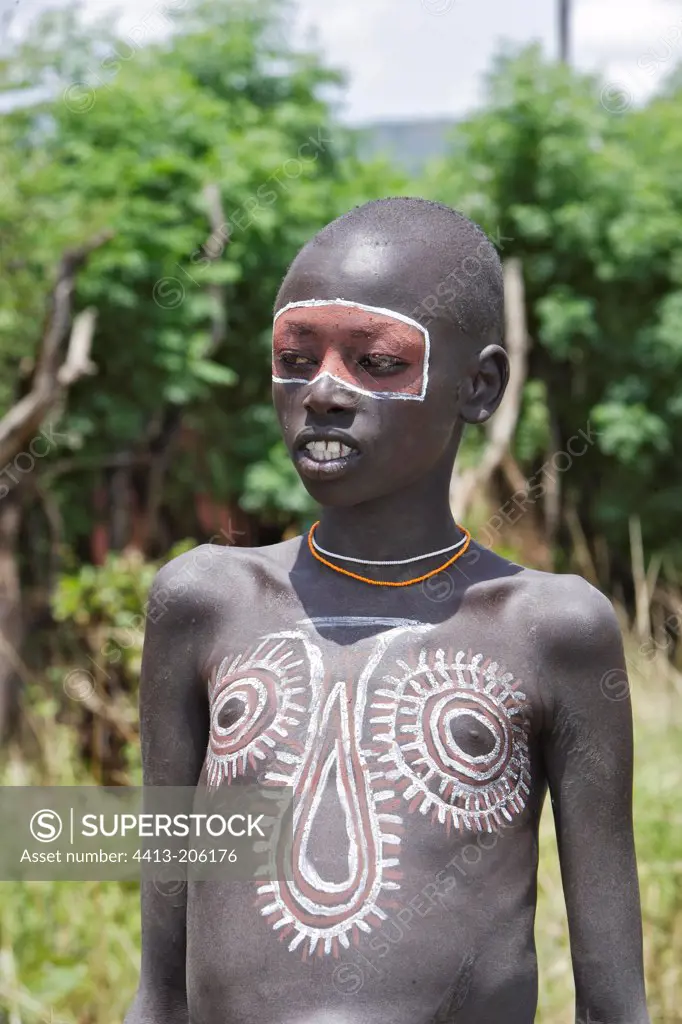 Portrait of a Surma boy with ritual paintings Ethiopia