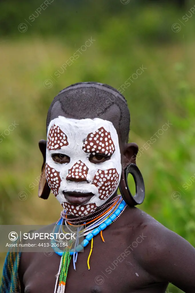 Portrait of Surma girl with face ritual paintings Ethiopia