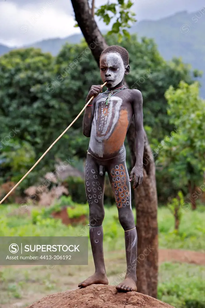 Surma boy with ritual body paintings Ethiopia