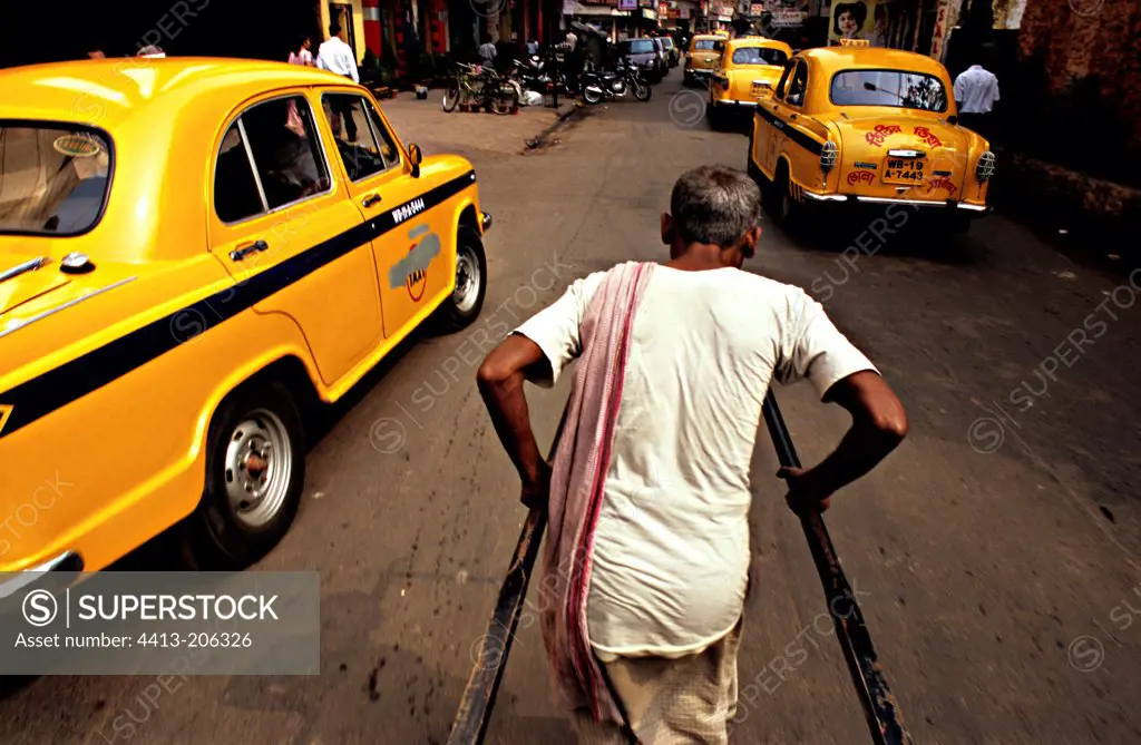 Rickshaw and taxis on the streets of Calcutta India