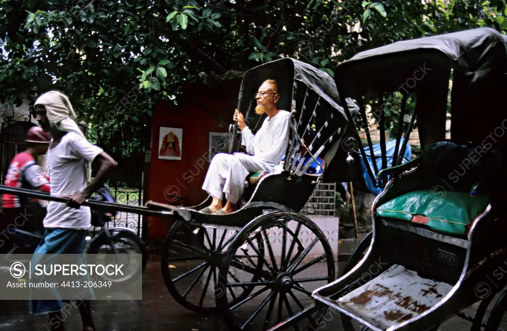 Rickshaws in the rain on the streets of Calcutta India