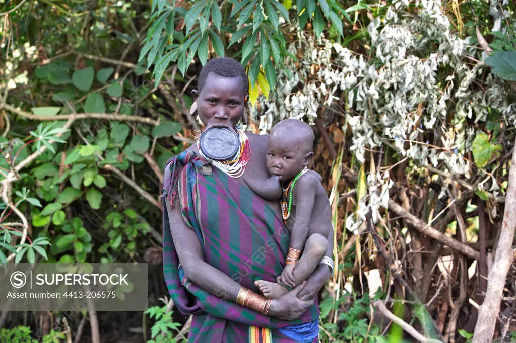 Surma woman holding her child Ethiopia