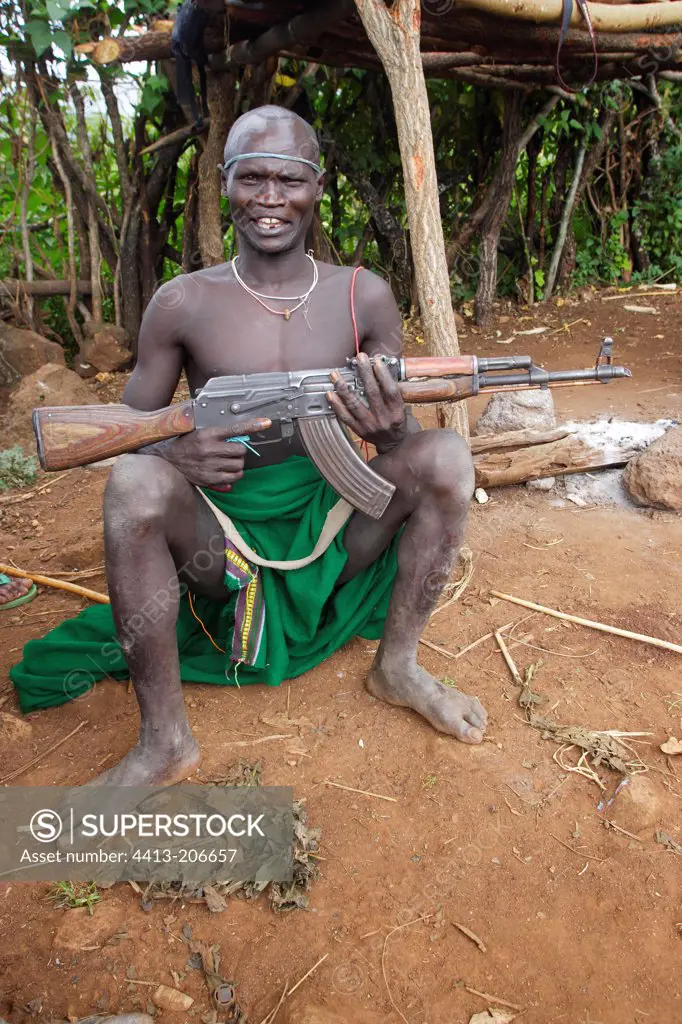Surma warrior armed with a military rifle Ethiopia