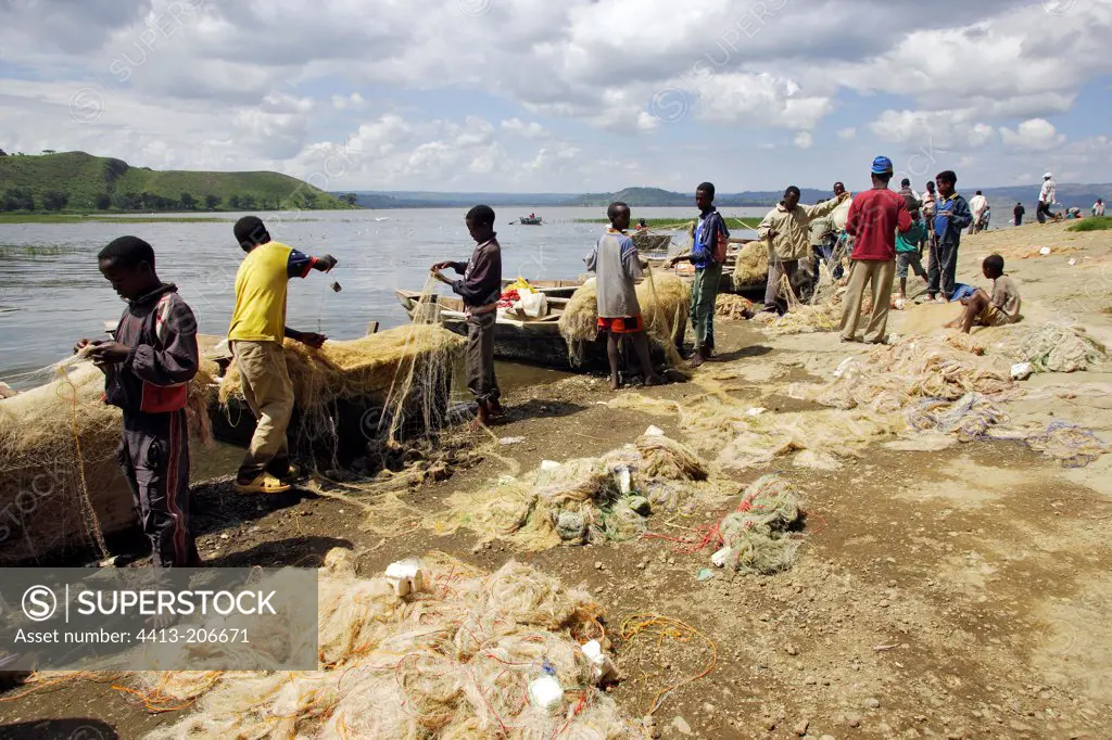 Fishermen repearing their nets Fish market of Awassa