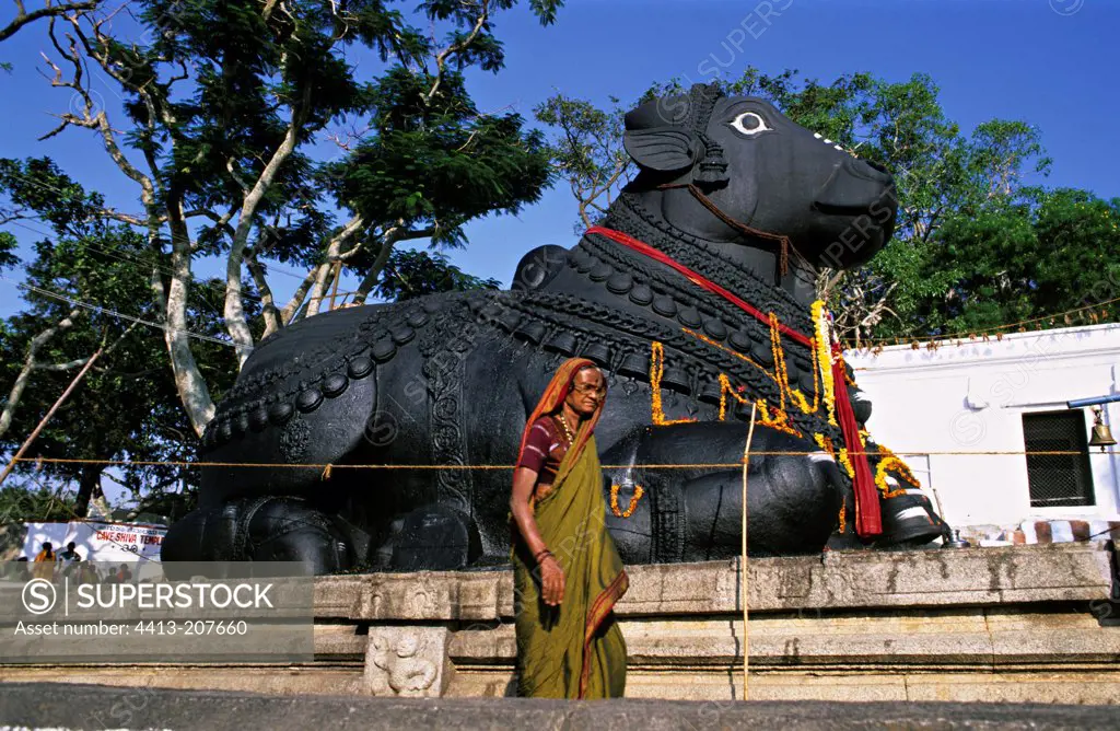 The statue of Nandi and old woman Mysore India