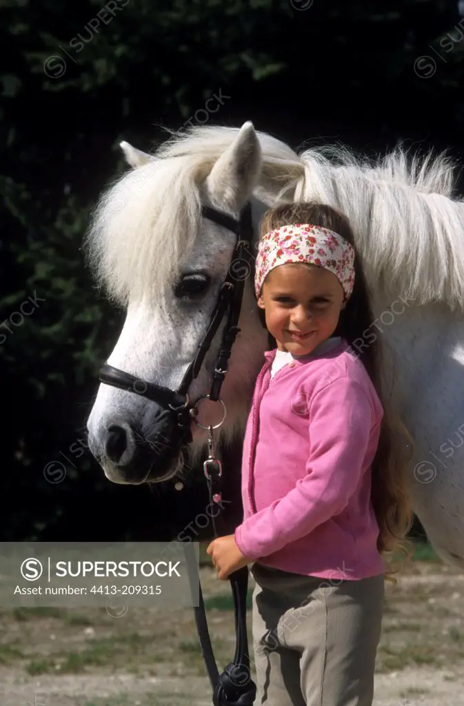 Little girl and her pony Shetland France