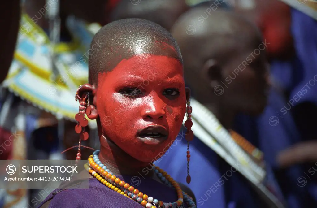 Masai young girl adorned during a circumcision ceremony