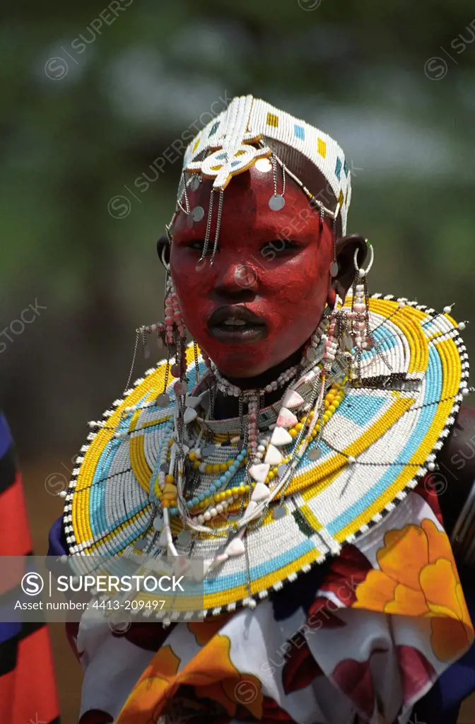 Masai young girl adorned during a circumcision ceremony