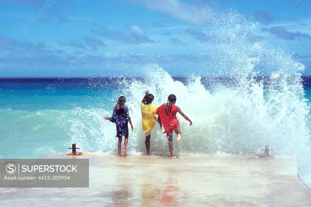 Children Chepeneche playing in the water New Caledonia
