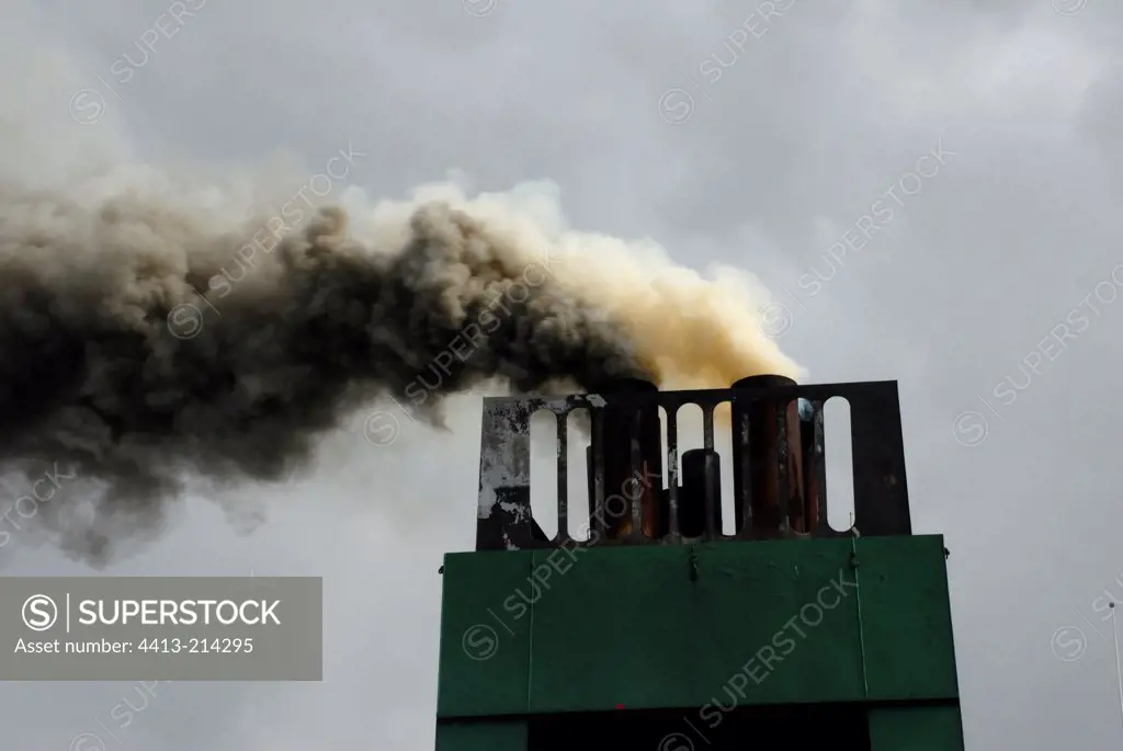 Smoke pollution at the start of a ferry Cherbourg France