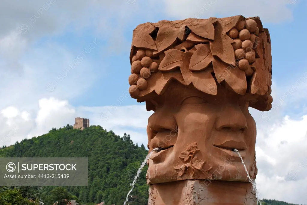 Fountain le Bacchus in sandstone on a roundabout France