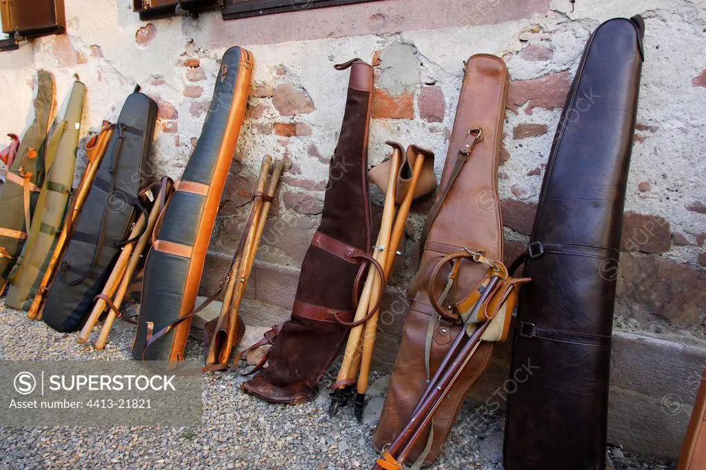 Rifles in their cases against a wall in Alsace