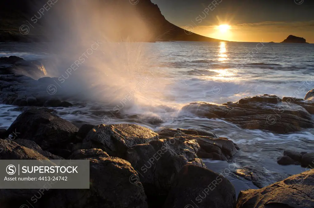 Rock shore at sunset Faskrudsfjördur Iceland