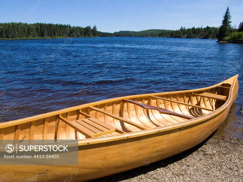 Canoe on the bank of Lac du Fou Quebec Canada