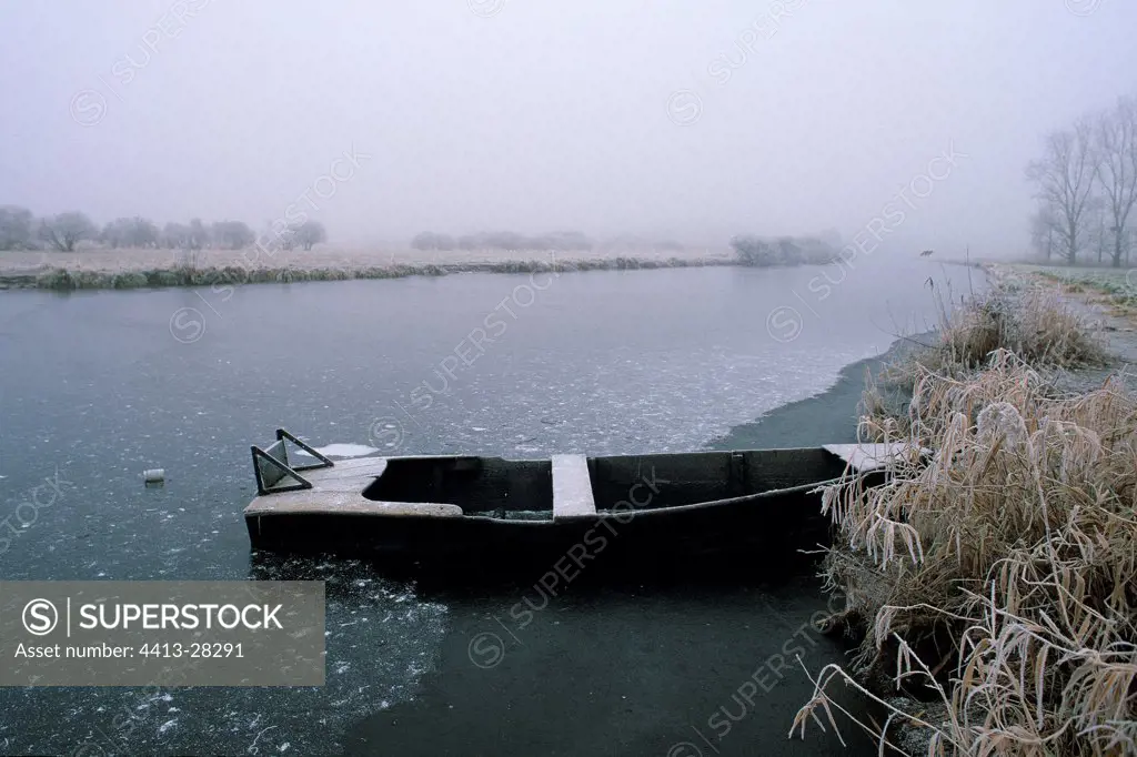 Boat on a freezing canal Loire-Atlantique France