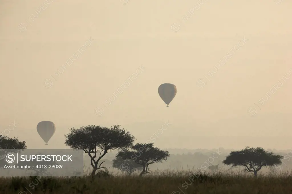 Hot air-balloons in fog of the Masai Mara Reserve Kenya