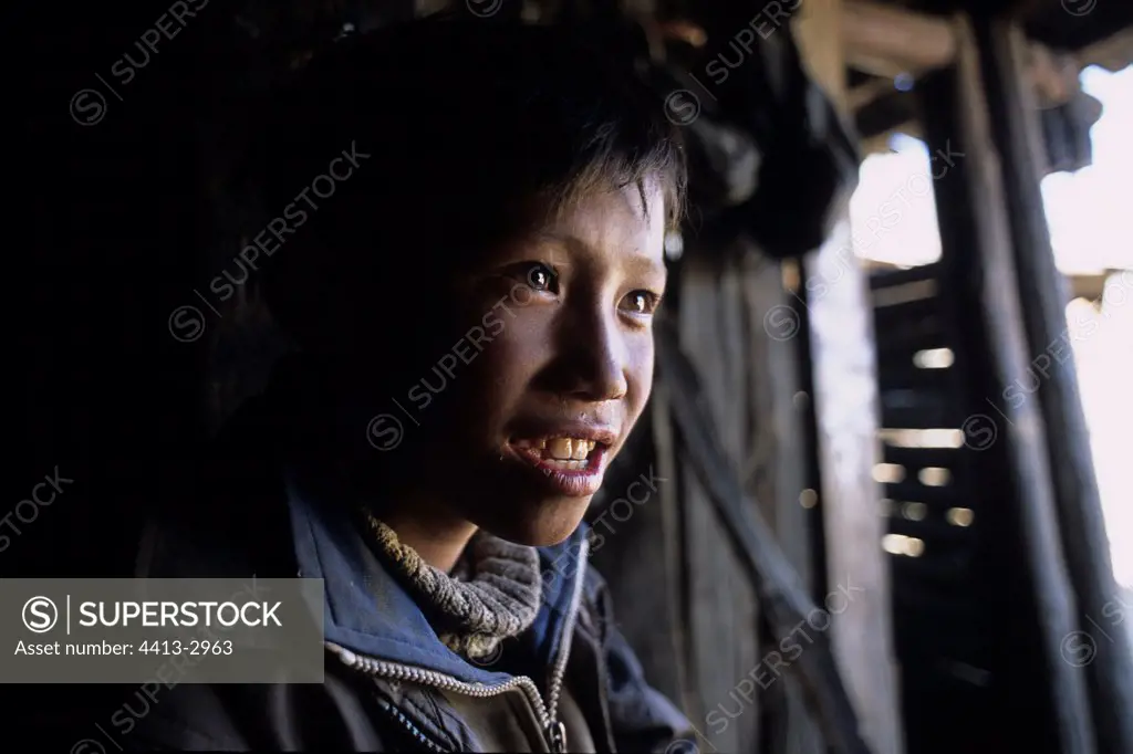 Portrait of a Yi child Yunnan China
