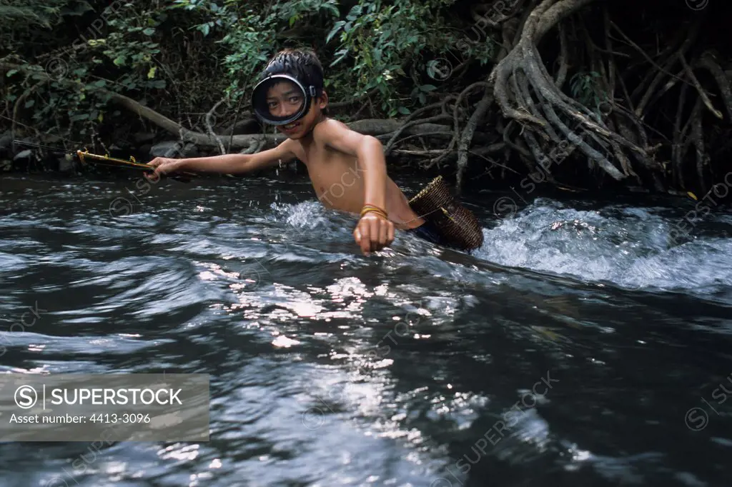 Akha child fishing with the harpoon District of Muang Sing Laos