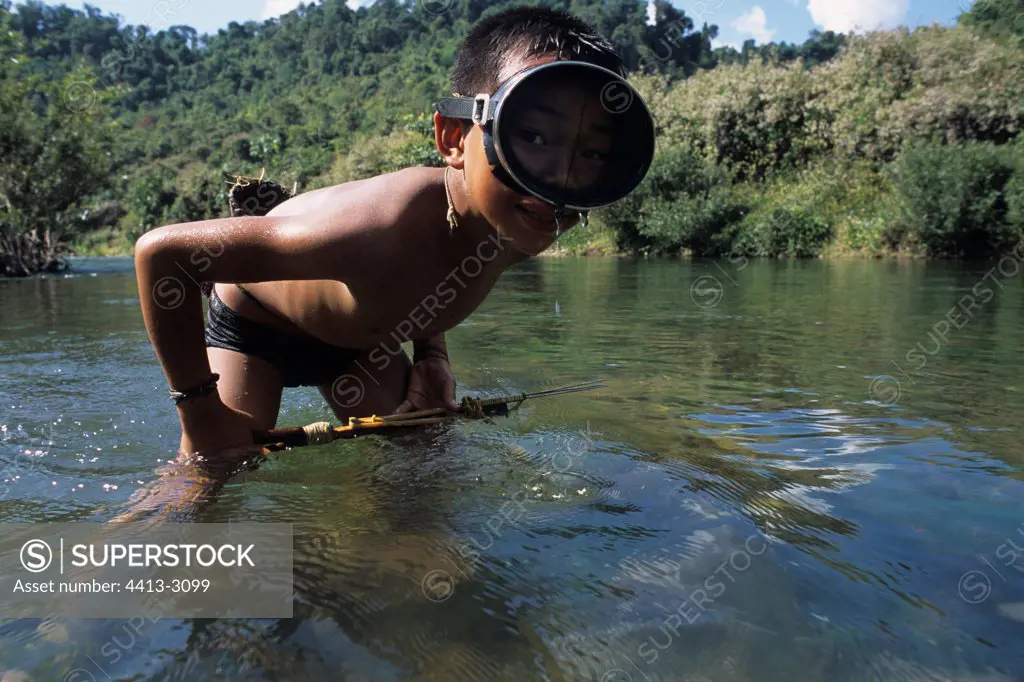 Akha child fishing with the harpoon District of Muang Sing Laos