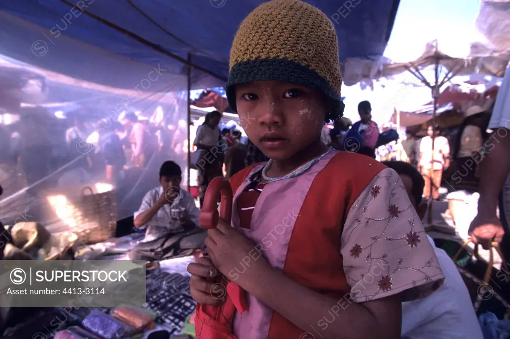 Young girl on a market close to the lake Inle Myanmar