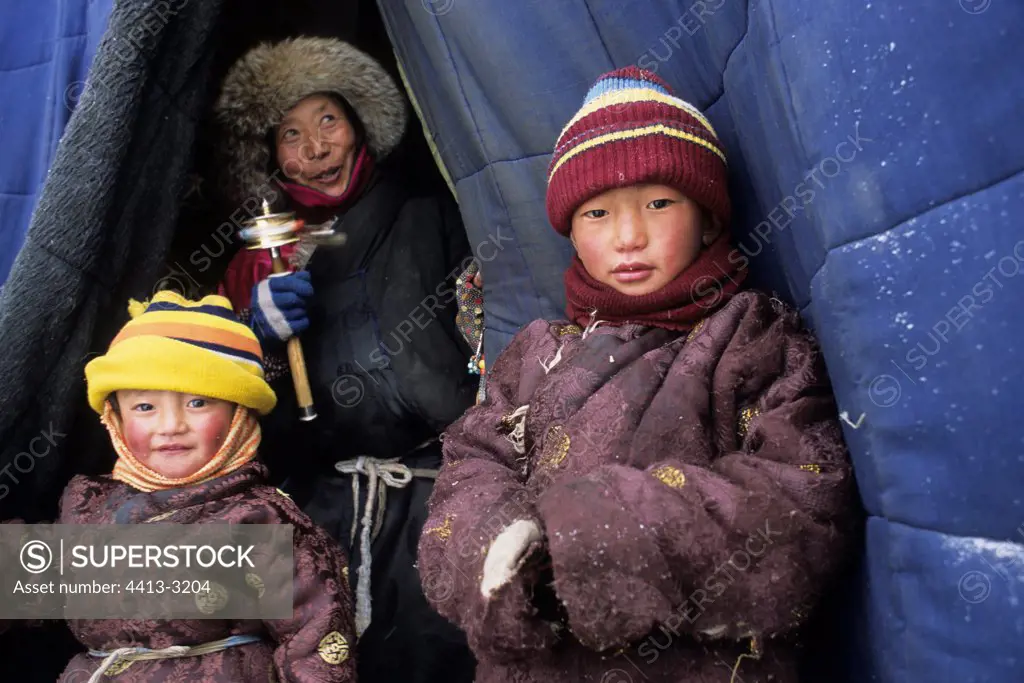 Tibetan children at the entry of a store Xiewu Kham area